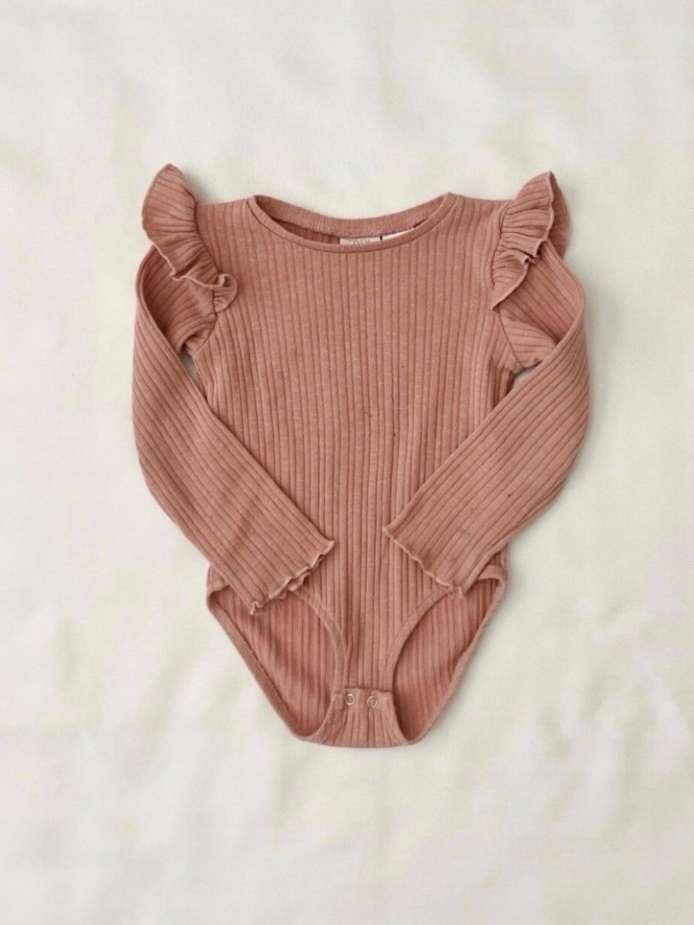 Zara Ribbed Long-Sleeve One-Piece in Dusty Pink with Ruffle Shoulders